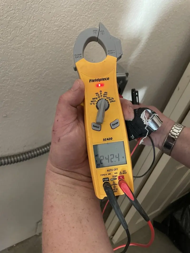 Voltage testing with clamp meter during Electrical Installation Services in Bucksport
